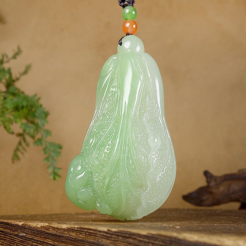 Hetian Jade Pendant - Ruyi Cabbage: Title: Hetian Jade Pendant - Ruyi Cabbage Origin: Chinese Date/Period: After2025 Materials: Hetian Jade Dimensions: 59x35x28(mm) 2.32x1.38x1.10(inches) Weight 0.14 lbs/65g Reserve: $599.00 Shipping:<