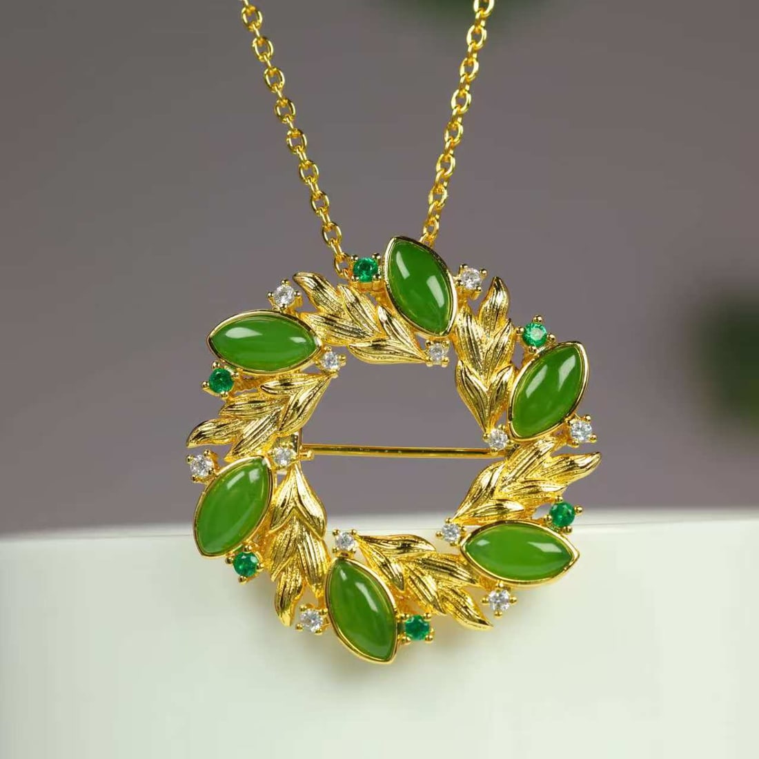 Green Hetian Jade Pendant/Brooch with Necklace: Title: Green Hetian Jade Pendant/Brooch with Necklace Origin: Chinese Date/Period: After2025 Materials: Hetian Jade Dimensions: 4x8(mm) 0.16x0.31(inches) Reserve: $60.00 Shipping:Domestic: