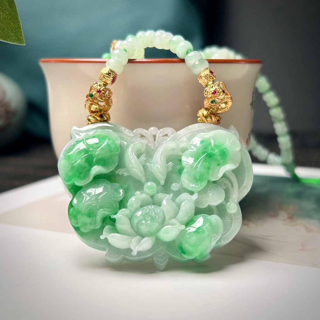 Green Jadeite Hand-Carved Fish & Lotus Pendant w Certificate: Title: Green Jadeite Hand-Carved Fish & Lotus Pendant w Certificate Origin: Chinese Date/Period: After2025 Materials: Jadeite Dimensions: 42.6x55.6x12.8(mm) 1.68x2.19x0.50(inches) Reserve: $799.00 Shi