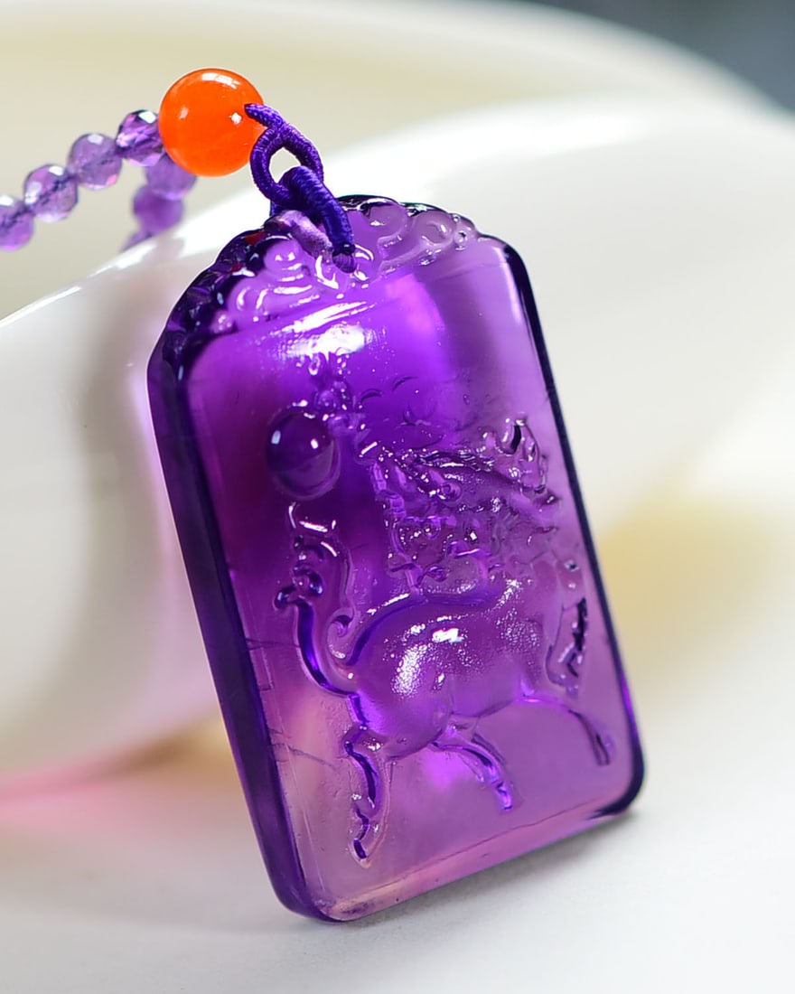 Natural Amethyst Pendant - Kylin: Title: Natural Amethyst Pendant - Kylin Origin: Chinese Date/Period: After2026 Materials: Amethyst Dimensions: 41.5x25.2x11.2(mm) 1.63x0.99x0.44(inches) Reserve: $299.00 Shipping:Domestic: