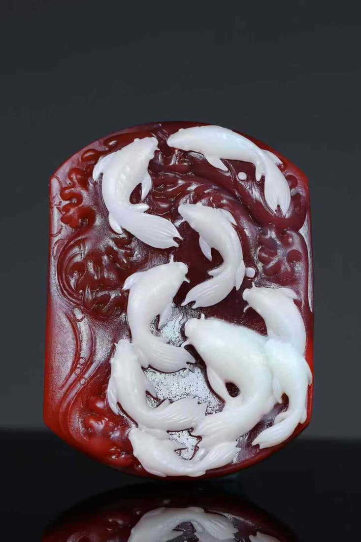 Natural Nanhong Agate Hand-Carved Fish Pendant w Certificate: Title: Natural Nanhong Agate Hand-Carved Fish Pendant w Certificate Origin: Chinese Date/Period: After2026 Materials: Nanhong Agate Dimensions: 55.6x41.5x14.6(mm) 2.19x1.63x0.57(inches) Weight