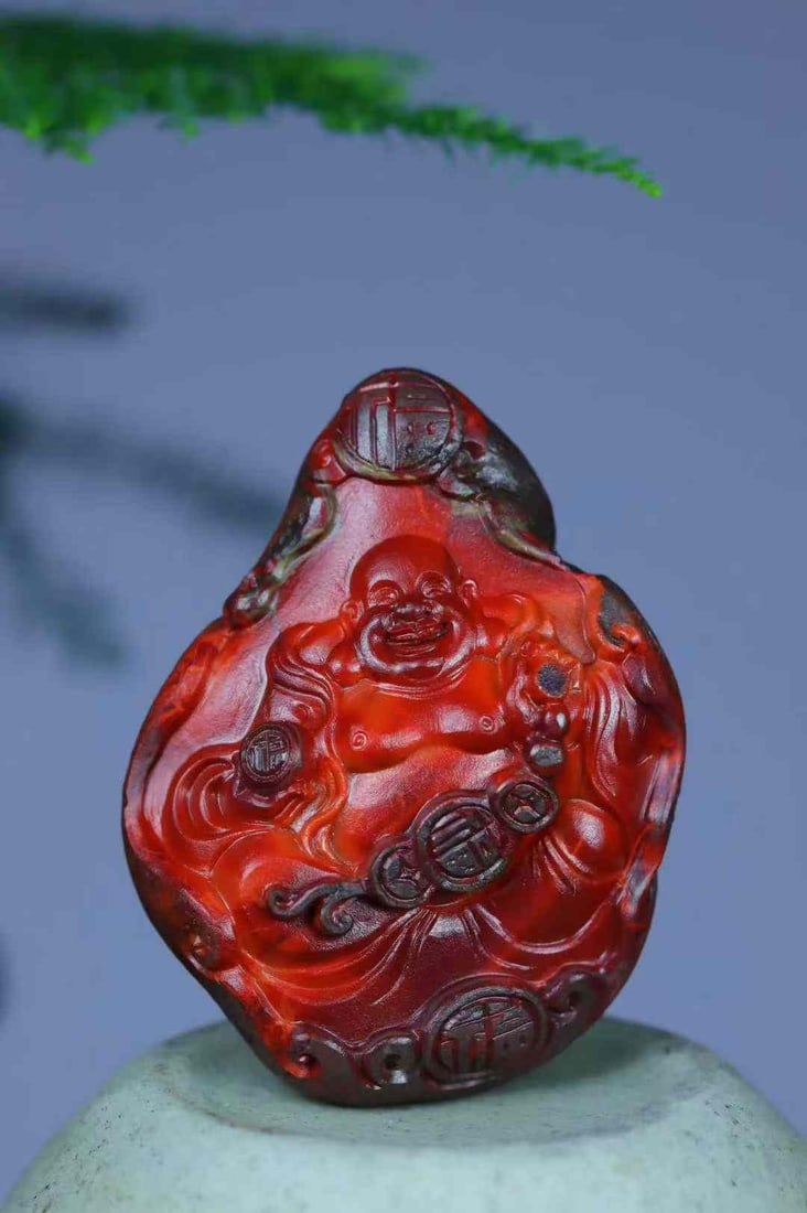 Natural Nanhong Agate Hand-Carved Laughing Buddha Pendant with Certificate: Title: Natural Nanhong Agate Hand-Carved Laughing Buddha Pendant with Certificate Origin: Chinese Date/Period: After2026 Materials: Nanhong Agate Dimensions: 38.8x30x17(mm) 1.53x1.18x0.67(inches) Weig