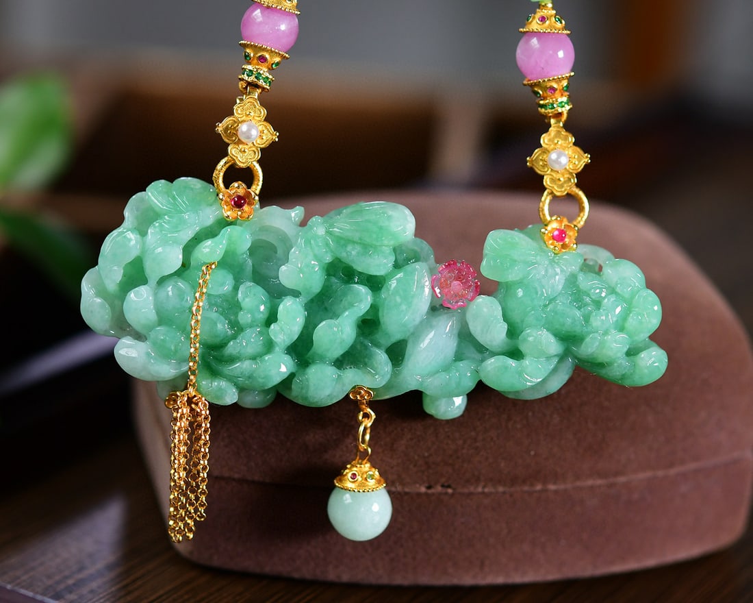 Pink Tourmaline,Green Jadeite Hand-Carved Peony Pendant: Title: Pink Tourmaline,Green Jadeite Hand-Carved Peony Pendant Origin: Chinese Date/Period: After2025 Materials: Tourmaline,Jadeite Dimensions: 83x32x12.5(mm) 3.27x1.26x0.49(inches) Reserve: $888.00 S