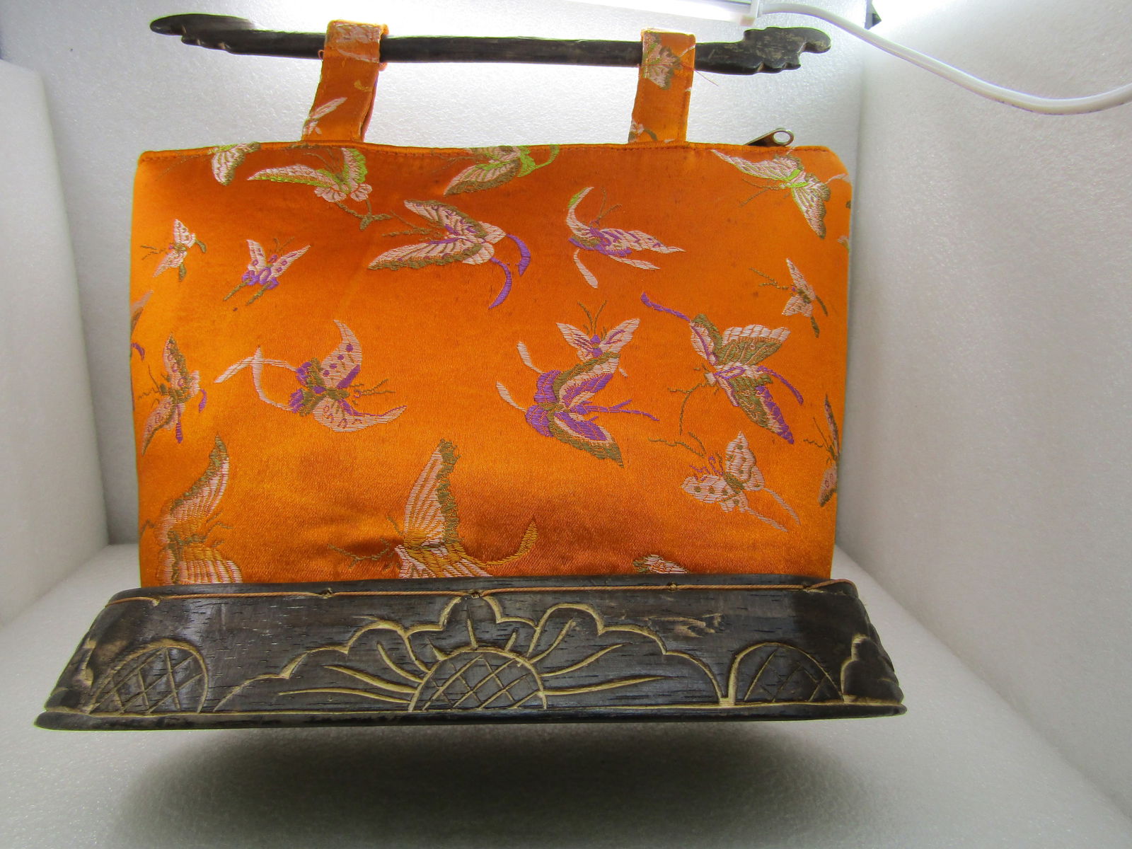 Vintage Asian Orange Silk Like Butterlfy Purse, Signed Jivaco, Wood Handles and Base: Vintage Asian Orange Silk Like Butterlfy Purse, Signed Jivaco, Carved Wood Handles and Base. Jivaco is Ilana V. Jivago, Beverly Hills, since 1994. Orange silk like butterfly pattern, signed Jivago. 8.