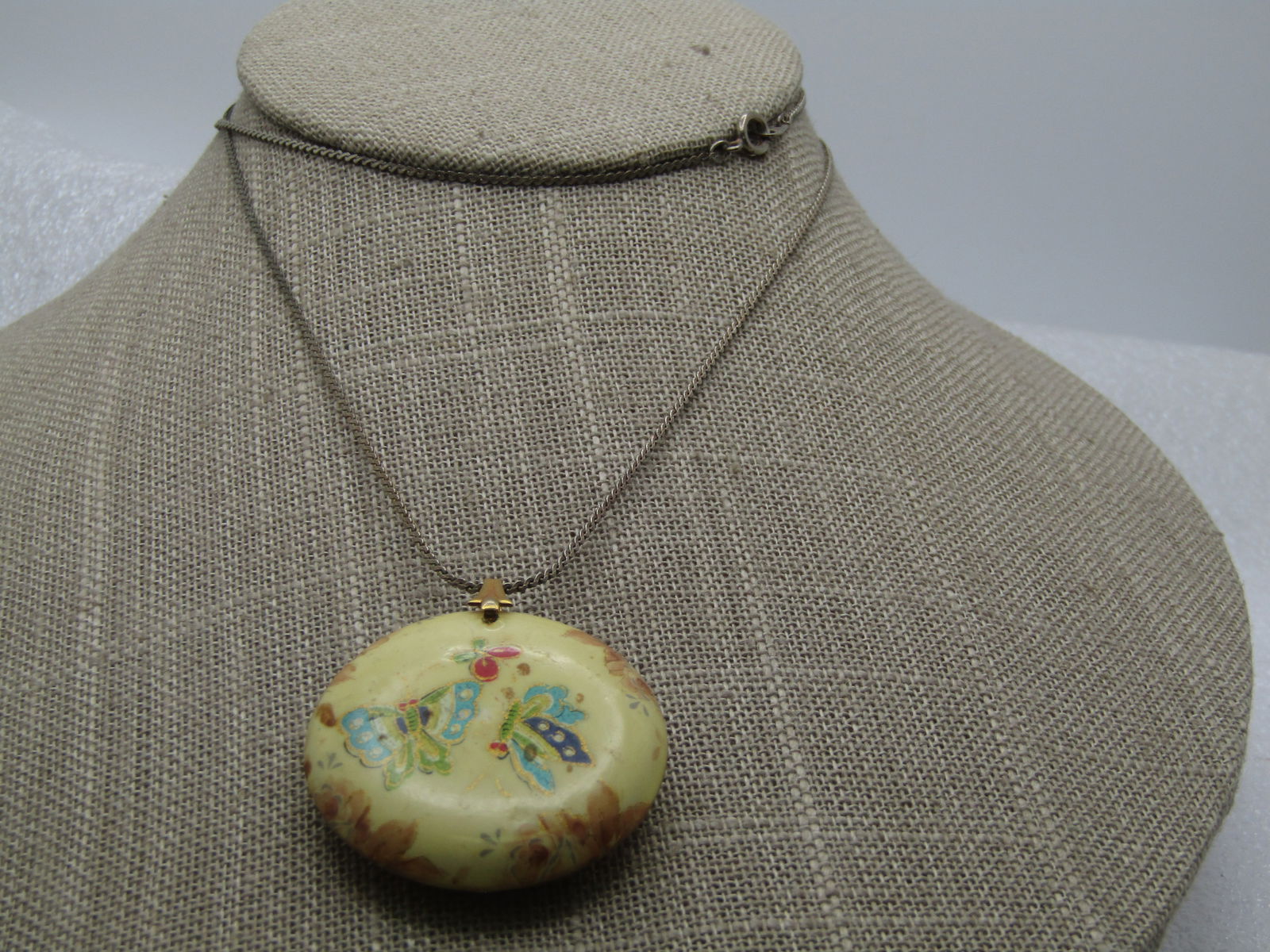 Vintage Chunky Butterfly Pendant Necklace, 1970's-1980's, 24": Vintage Chunky Butterfly Pendant Necklace, 1970's-1980's, 24". Pale Yellow Black 10.5mm thick 1.5" round pendant with butterflies in teal, green, purple and red fluttering in both sides with floral ac