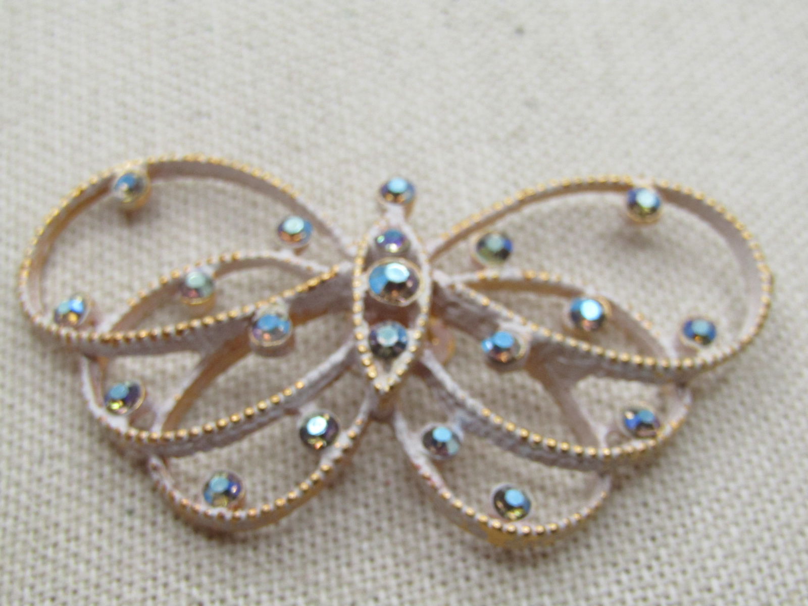 Vintage Rhinestone Butterfly Dress Clip, White Enameling, 1950's-1960's. It is appx. wide and 1.25" - 2