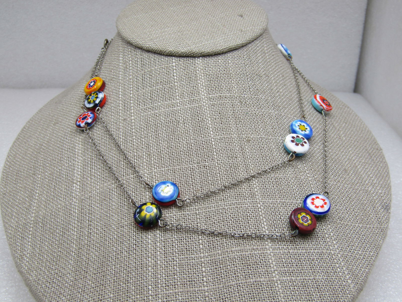 Vintage Glass Floral Beaded Necklace, 32", 1960's-1970's.: Vintage Glass Floral Beaded Necklace, 32", 1960's-1970's. Murano style 1/2" floral glass round and flat beads in reds, greens, blues, yellow, white, orange, purple, pink. Each bead is different than t