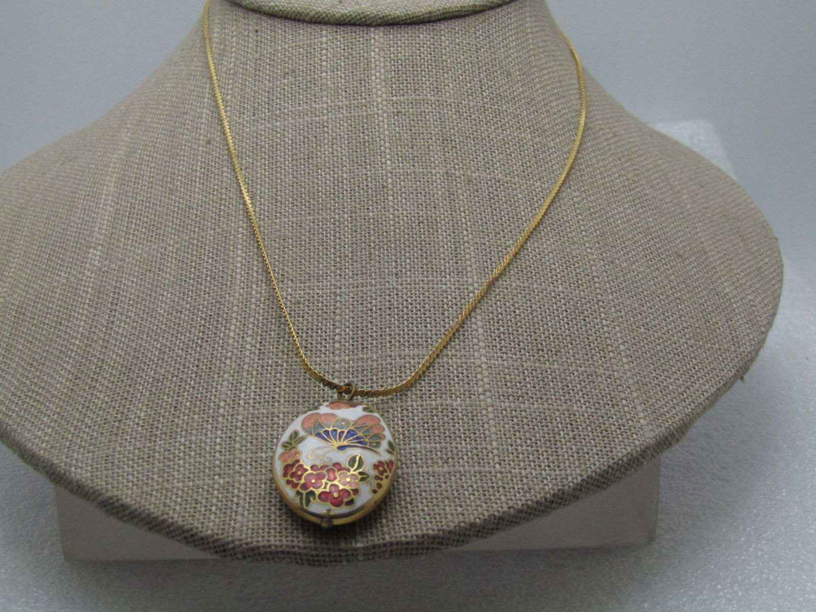 Vintage Cloisonne Butterfly Necklace, 17", 1970's: Vintage Cloisonne Butterfly Necklace, 17", 1970's, Gold tone 1mm herringbone chain with spring clasp. THe pendant is an oval and domed front and back with the images on front and back. Peach, blue but