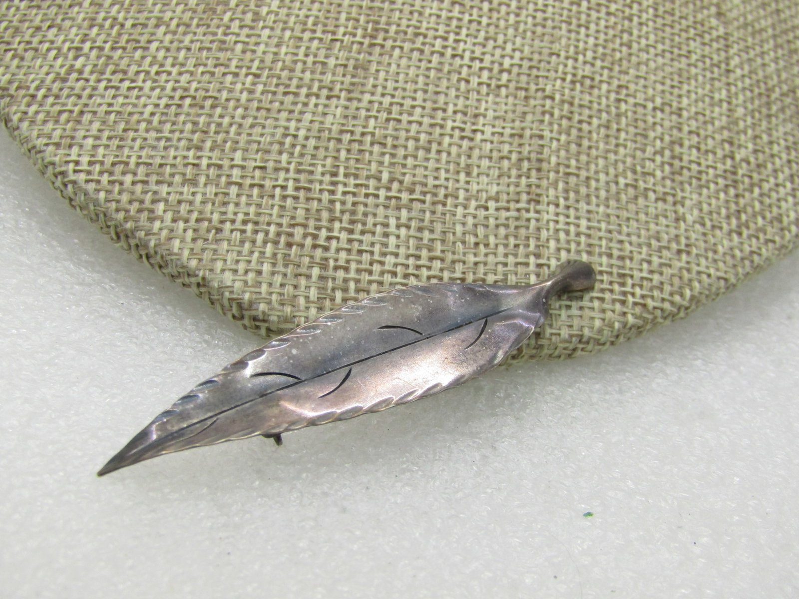 Vintage Sterling Stuart Nye Leaf Brooch, 2.5": Vintage Sterling Stuart Nye Leaf Brooch, 2.5" and 1/2" wide, 2.57 grams. This leaf also comes in a longer version. Staurt Nye Hand Wrought Sterling. Southern Highland Handicraft Guild Member. Piece