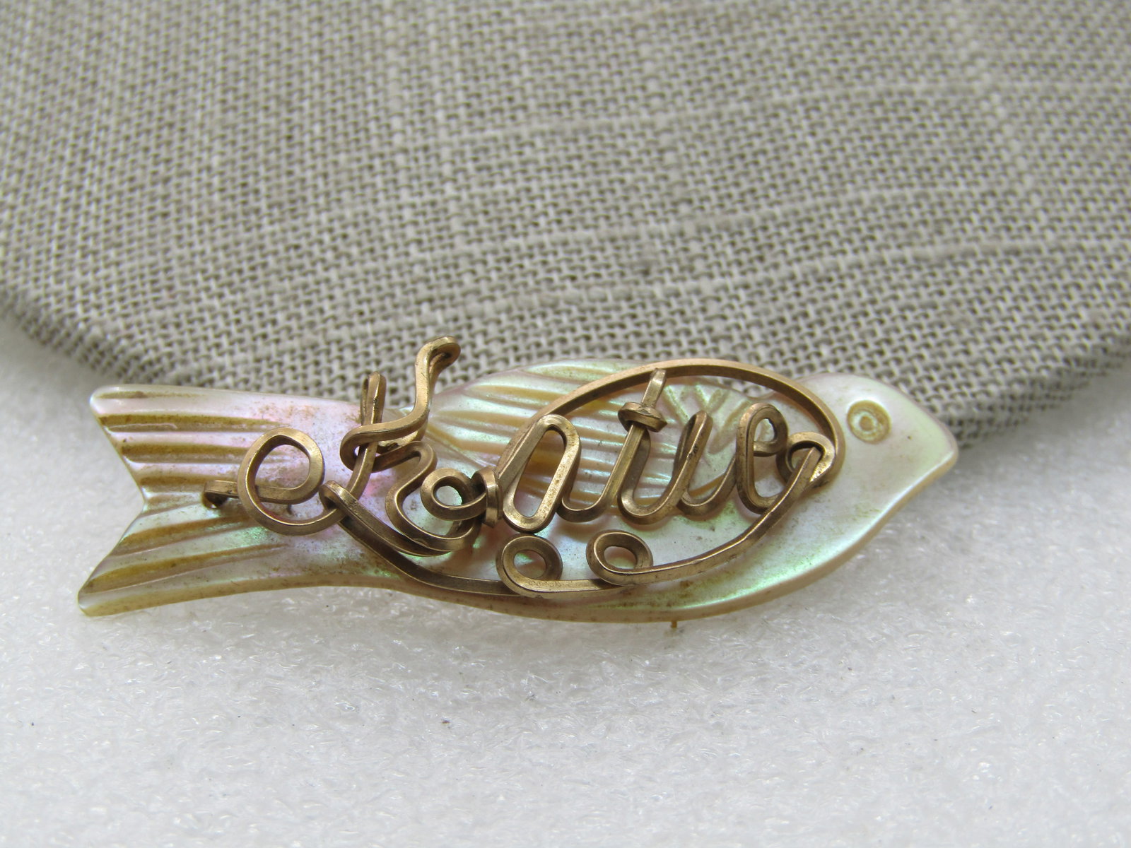 Vintage MOP Wire Name Bird Brooch, Katie, 10kt G.F. Wire, 1940's-1950's: Vintage Mother-of-Pearl Katie Bird Brooch, 10kt G.F. Wire, 1940's-1950's, 2" by 3/4". Ornately written name that appears to be Katie with a scrolled wire accent around the name after the K, surroundin