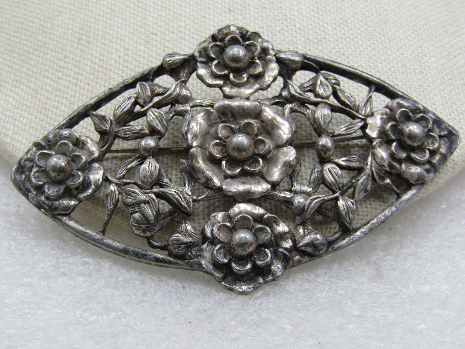 Vintage Silver Floral Brooch, 3.25" by 2.25", 1920's-1930's: Vintage Silver Floral Brooch, 3.25" by 2.25", 1920's-1930's. This acid tests as silver. It may not be .925 but it is silver and given the testing, I would say it is .900 to .925. Weight of the brooch