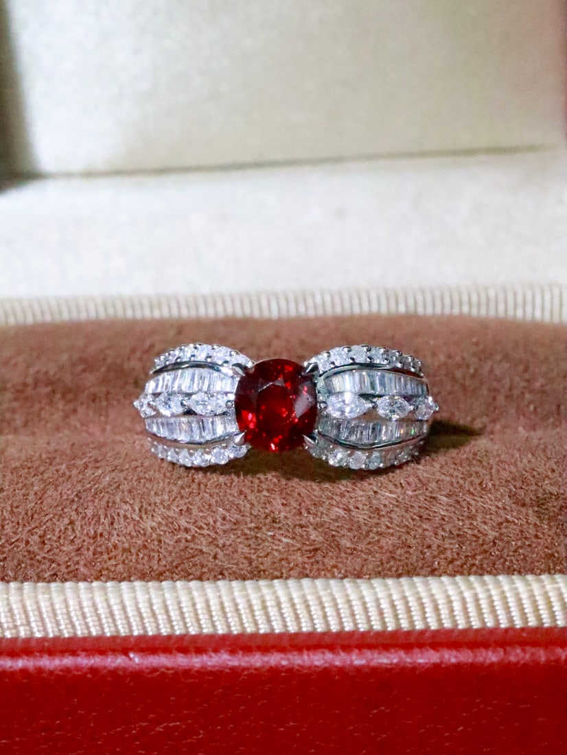 18K Gold Ruby Ring: Title: 18K Gold Ruby Ring Description: This 18K Gold Ruby Ring captures the essence of vintage elegance with its unique design, offering a sense of personal sophistication. The main ruby stone boasts