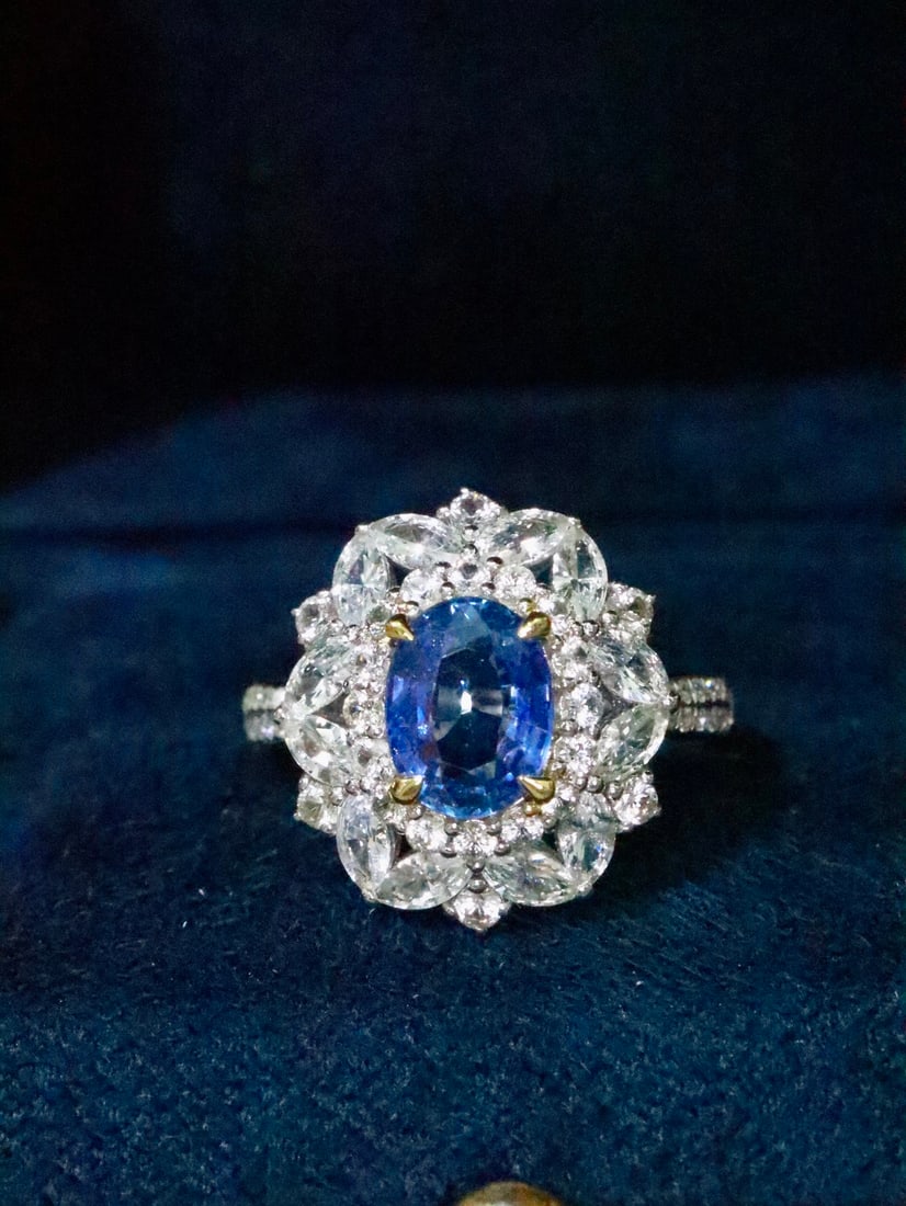 18K Gold Sapphire Ring: Title: 18K Gold Sapphire Ring Description: This 18K Gold Sapphire Ring is a timeless masterpiece, exuding an allure that is both captivating and enduring. Its flawless clarity and deep, vibrant hue cr