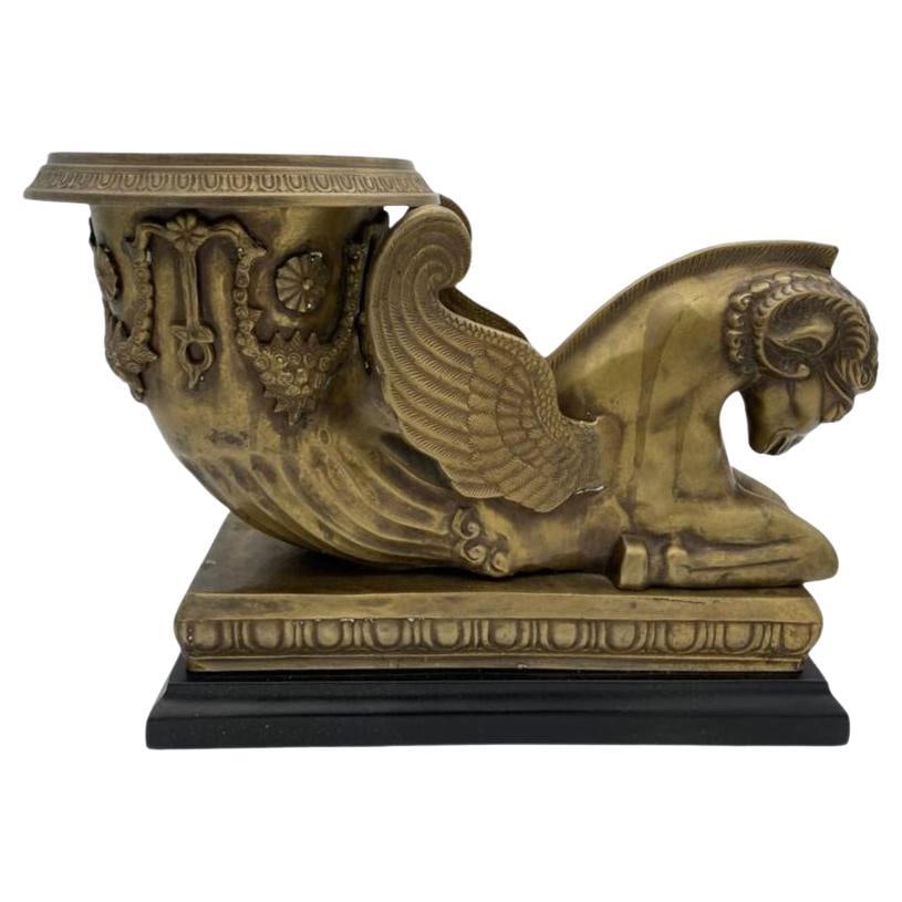 Golden Fleece Chrysomallos Winged Ram Bronze Mantle Urn: Title: Golden Fleece Chrysomallos Winged Ram Bronze Mantle Urn Description: Early 20th Century Bronze mantle urn with black composite base featuring the Greek Golden Fleece Chrysomallos decorative