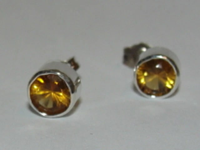 Sterling Silver Faceted Citrine Bezel Set Earrings Birthstone November: Title:Sterling Silver Faceted Citrine Bezel Set Earrings Birthstone NovemberDescription:This 12 piece astrology earring collection is an extension of my 2nd collection called "Plain Jane", a long