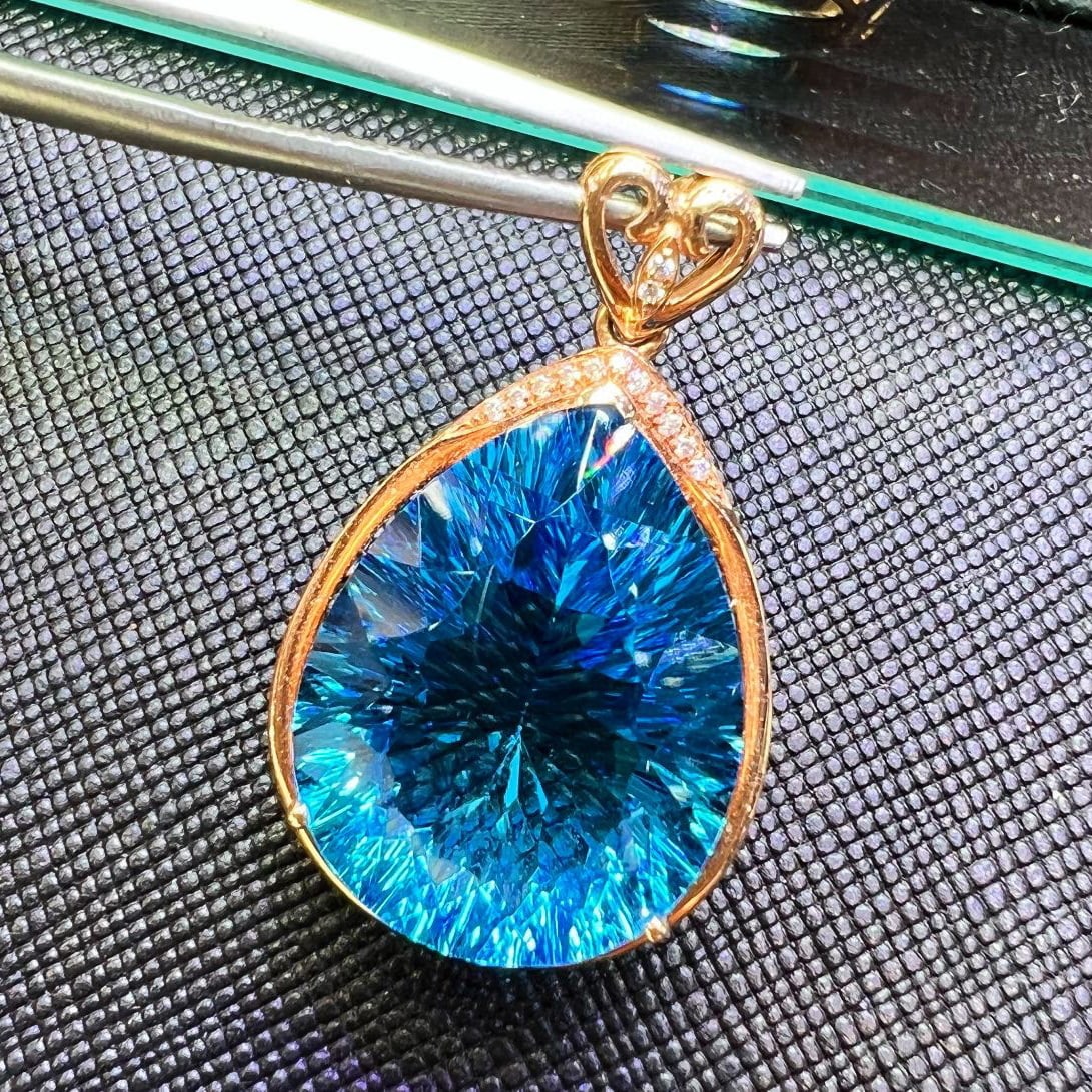 14K GOLD 17 CT NATURAL TOPAZ & DIAMOND PENDANT: Title:14K GOLD 17 CT NATURAL TOPAZ & DIAMOND PENDANT Description:Ref:230528635Gold Content:14K GoldMain Gemstone:TopazNumber of stones:1Shape:PearCarat Weight:17ct Color:BlueTreatment:NaturalCut Grade