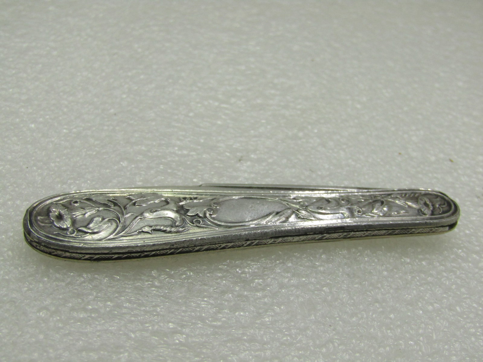 Antique Sterling Silver Art Nouveau Folding Knife , 5.5" Open: Title:Antique Sterling Silver Art Nouveau Folding Knife , 5.5" OpenDescription:Antique Sterling Silver Art Nouveau Folding Knife , 5.5" open and 3.25" when closed. Engraved with Julia on the blade.