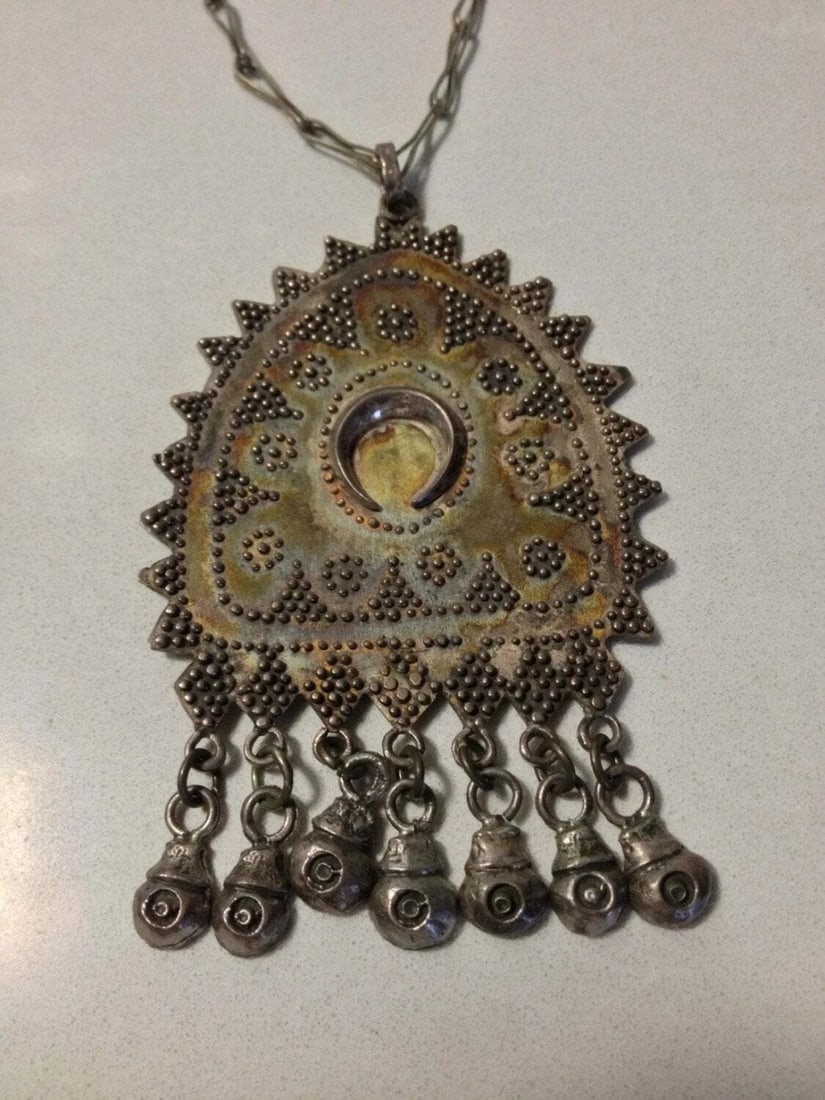 Sterling Silver Necklace with Brass Closure and Sterling Silver Ethnic Pendant: Title:Sterling Silver Necklace with Brass Closure and Sterling Silver Ethnic PendantDescription:Sterling silver necklace with a brass closure and an ethnic pendant made up of sterling silver as well.