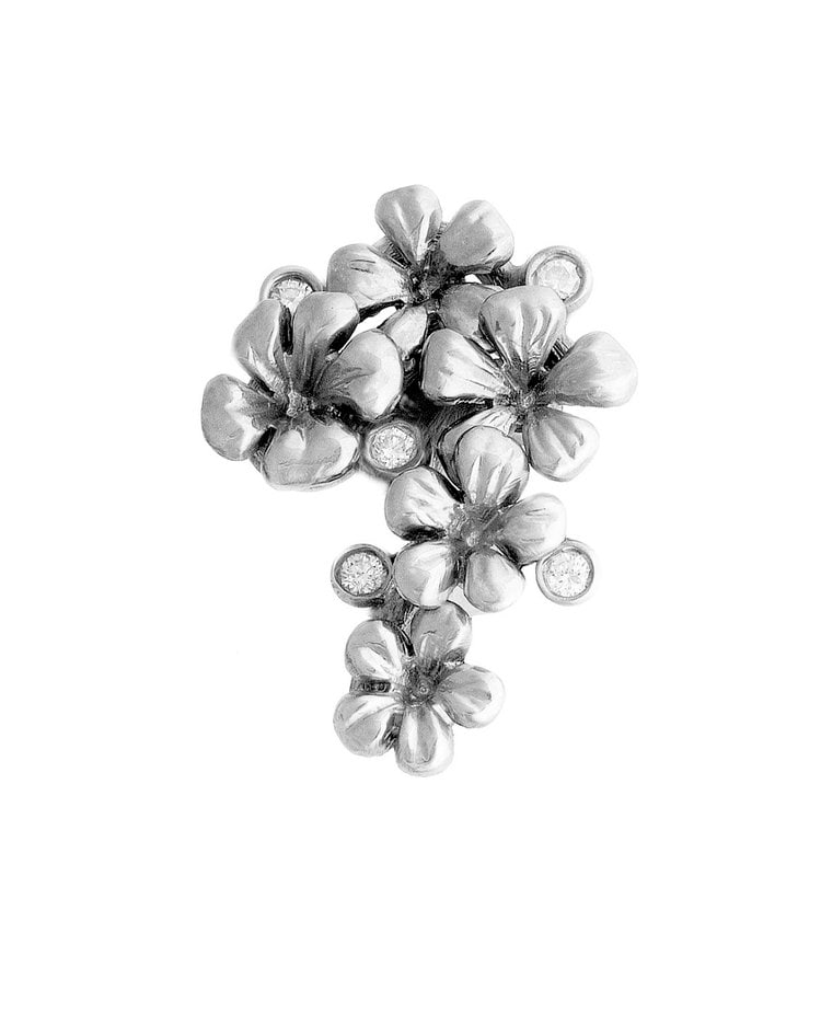 Sterling Silver Plum Blossom Pendant with Topaz: Title:Sterling Silver Plum Blossom Pendant with TopazDescription:This pendant is crafted in sterling silver, set with six natural topaz stones.A unique piece from the jewellery collection of oil