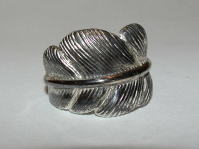 Tribal Inspired Feather Ring Band Alberto Juan: Title:Tribal Inspired Feather Ring Band Alberto JuanDescription:The ninth piece of my 11th collection of Native American inspired jewelry. This sterling silver feather ring/band is hand carved from