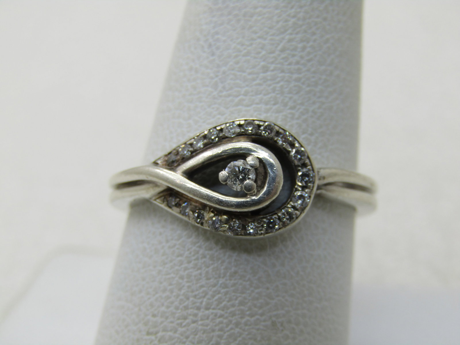 Vintage Sterling Silver Diamond Ring, Wrapped Halo, Sz. 9.5: Title:Vintage Sterling Silver Diamond Ring, Wrapped Halo, Sz. 9.5Description:Vintage Sterling Silver Diamond Ring, Wrapped Halo, Sz. 9.5. weight is papx. 3.64 grams. Signed with a double treardrop