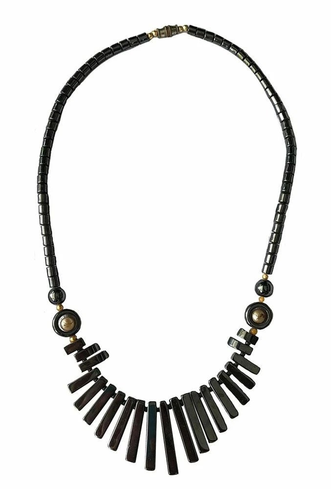 New Black Hemanite Necklace: Title:New Black Hemanite NecklaceDescription:New black hemanite fan bib bead necklace with golden beads. Measurement from large: 8.5" Measurement of the neck beads: 4mm 