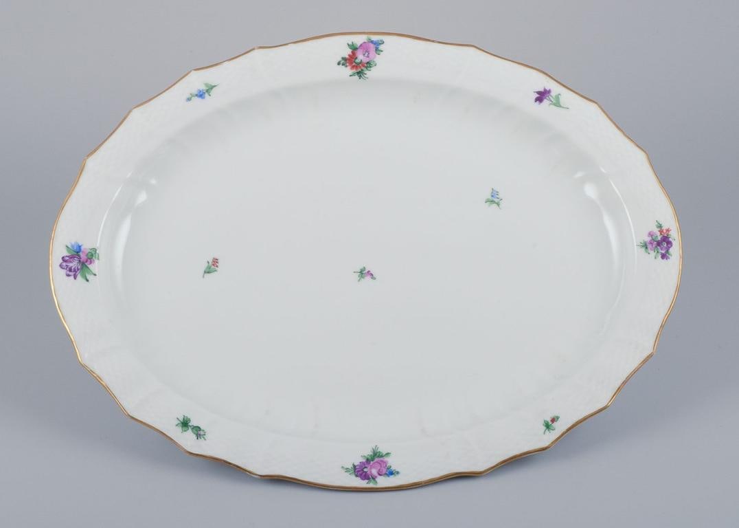 Royal Copenhagen Saxon Flower, very large oval serving platter in porcelain. Early 20th C.: Title: Royal Copenhagen Saxon Flower, very large oval serving platter in porcelain. Early 20th C. Description: Royal Copenhagen Saxon Flower, very large oval serving platter. Hand-painted with polychr