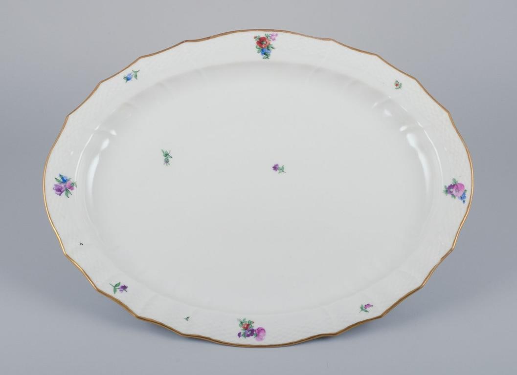 Royal Copenhagen Saxon Flower, very large oval serving platter in porcelain. Early 20th C.: Title: Royal Copenhagen Saxon Flower, very large oval serving platter in porcelain. Early 20th C. Description: Royal Copenhagen Saxon Flower, very large oval serving platter. Hand-painted with polychr