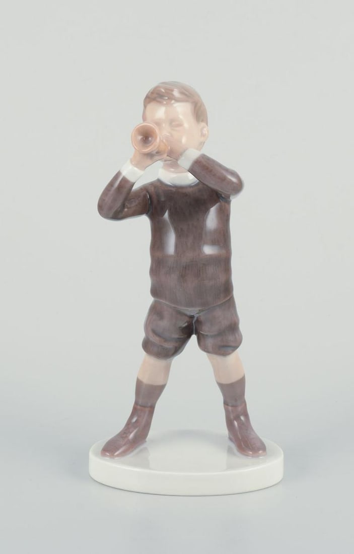 Bing and Grondahl, porcelain figurine of boy with horn. Approx. 1920s. - 2