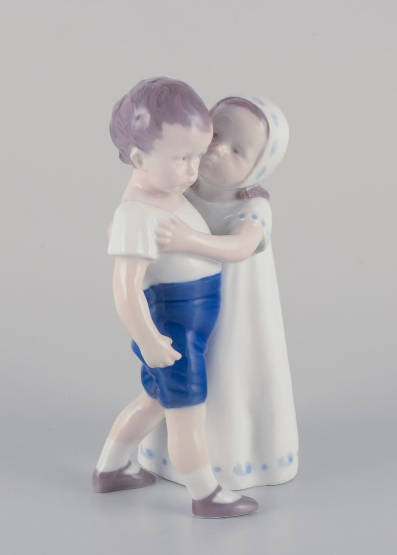 Bing & Grondahl, porcelain figurine of a little girl and boy. Approx. 1930s - 3