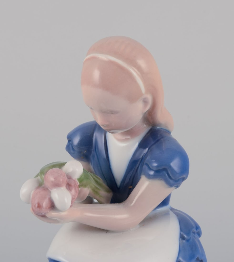 Bing & Grondahl, Denmark. Porcelain figurine of a seated girl with a bouquet of flowers, 1930s - 2