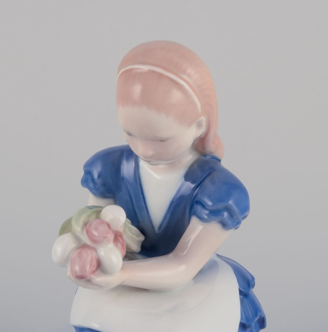 Bing & Grondahl, Denmark. Porcelain figurine of a seated girl with a bouquet of flowers, 1930s - 2