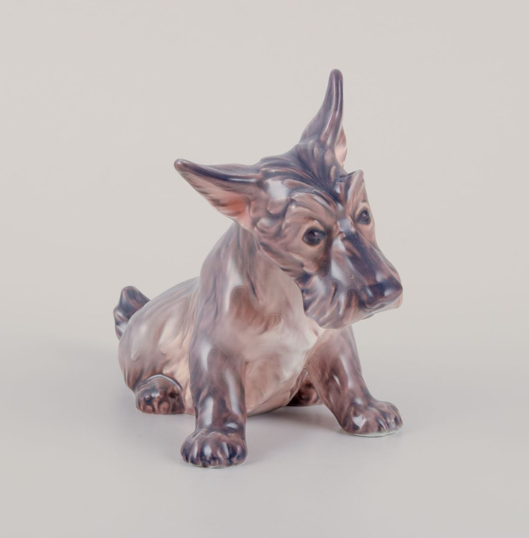 Dahl Jensen, porcelain figurine of seated Scottish terrier. Ca. 1930s.: Title: Dahl Jensen, porcelain figurine of seated Scottish terrier. Ca. 1930s. Description: Dahl Jensen, porcelain figurine of a seated Scottish terrier. Model number 1078. Design Jens Peter Dahl Jense