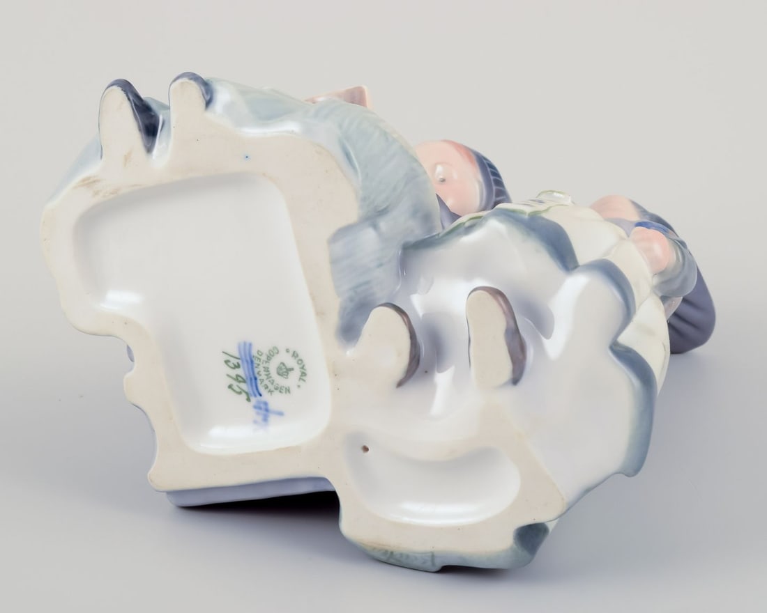 Royal Copenhagen figurine in porcelain. Two "Amager" girls in regional costume. Dated 1956 - 7