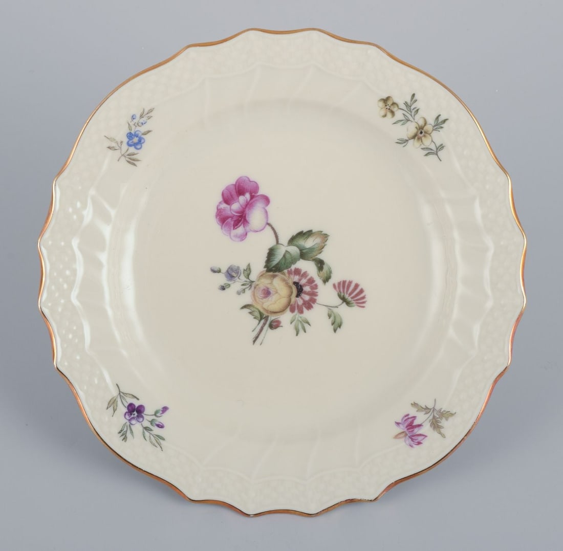 Royal Copenhagen, "Frijsenborg". Twelve plates decorated with floral motifs, gold rim. 1950s. - 2