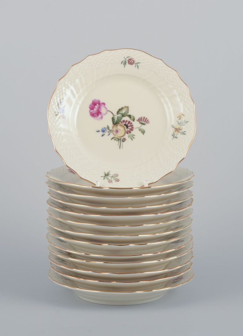 Royal Copenhagen, "Frijsenborg". Thirteen plates decorated with floral motifs, gold rim. 1950s.: Title: Royal Copenhagen, "Frijsenborg". Thirteen plates decorated with floral motifs, gold rim. 1950s. Description: Royal Copenhagen, "Frijsenborg". Thirteen plates. Decorated with floral motifs, gold