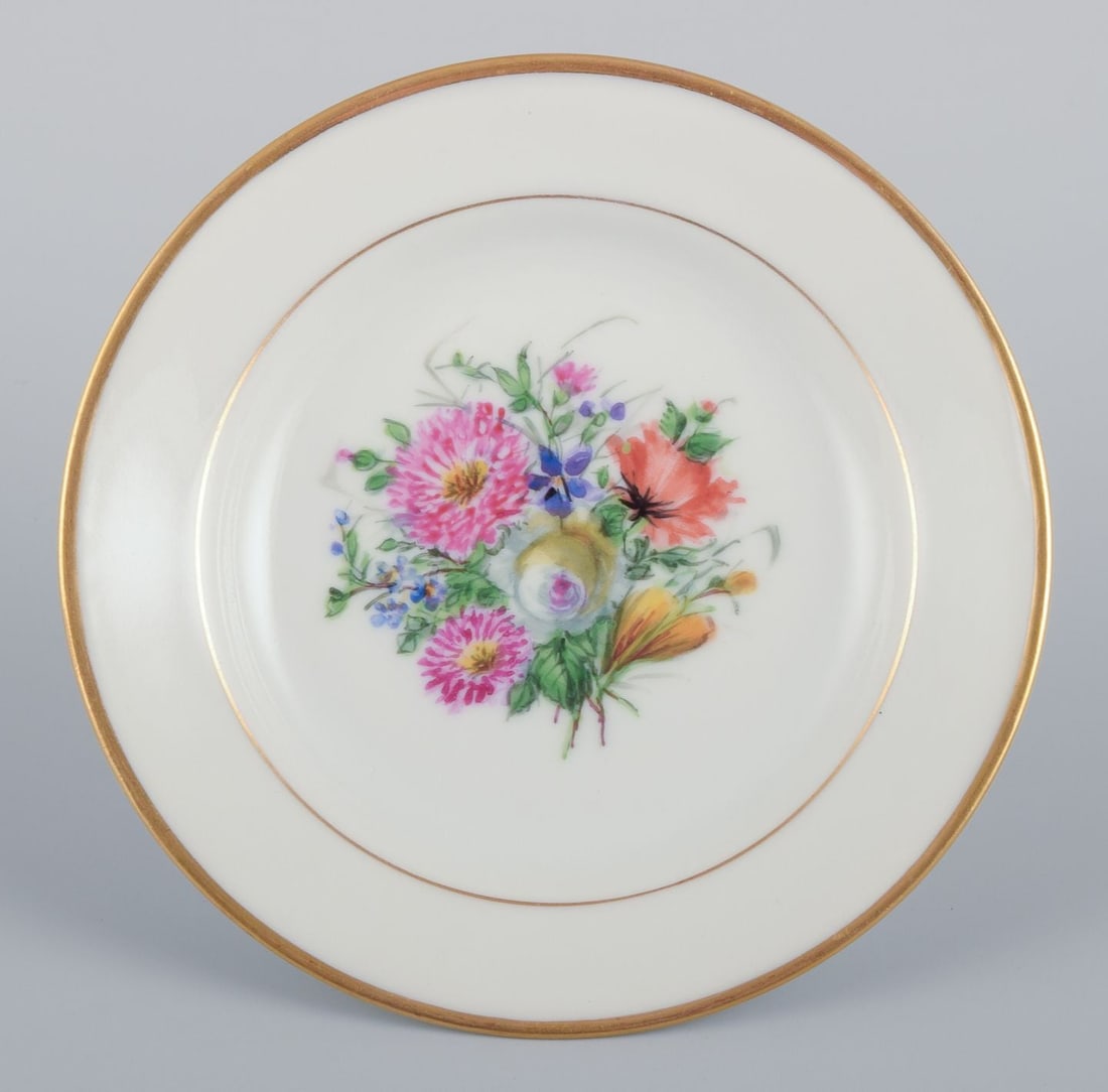 Bing & Grøndahl, set of four small plates with floral motifs and gold rim. Approx. 1920s. - 4