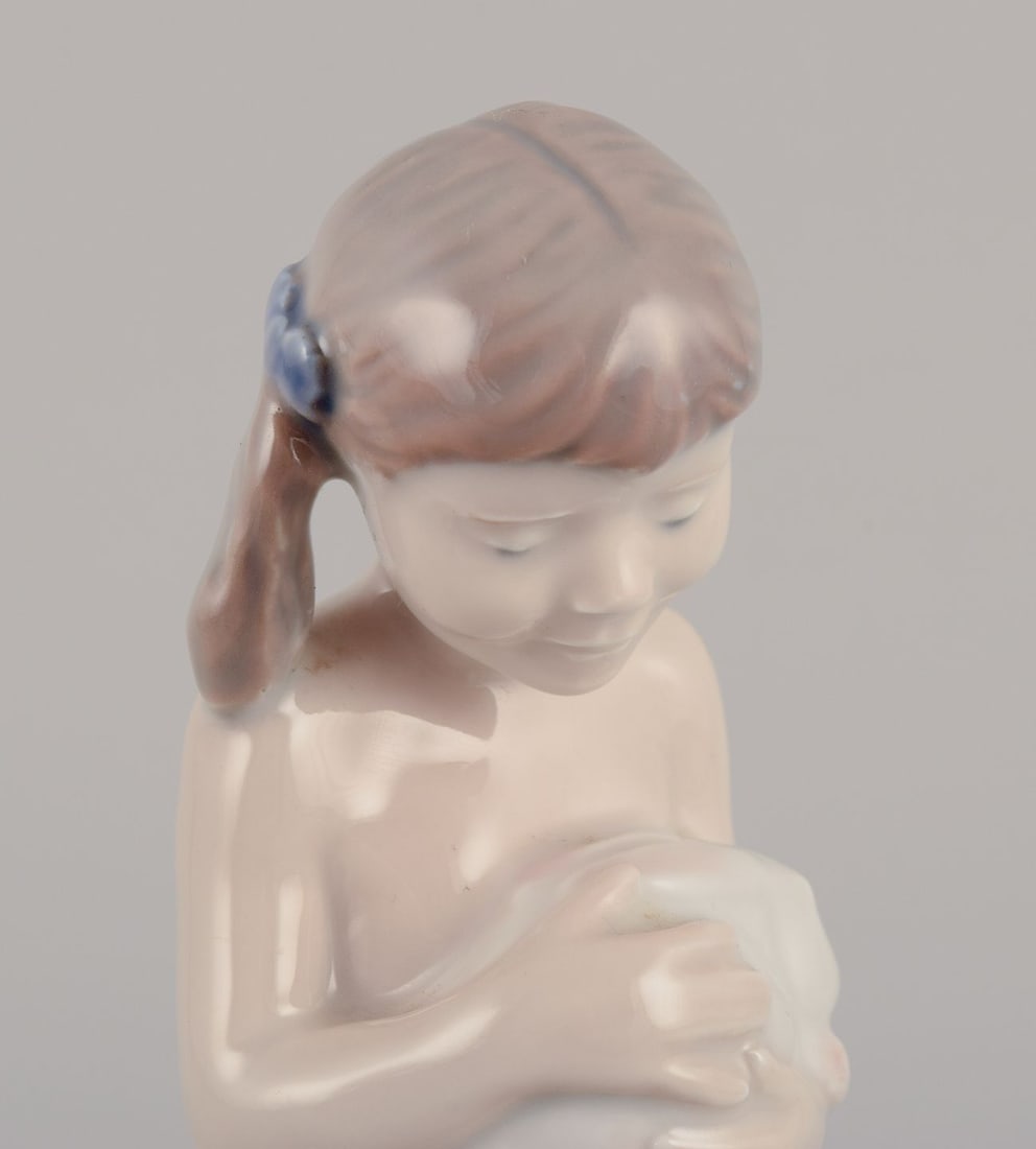 Royal Copenhagen porcelain figurine of a girl with a rabbit. 1980-1984. - 4