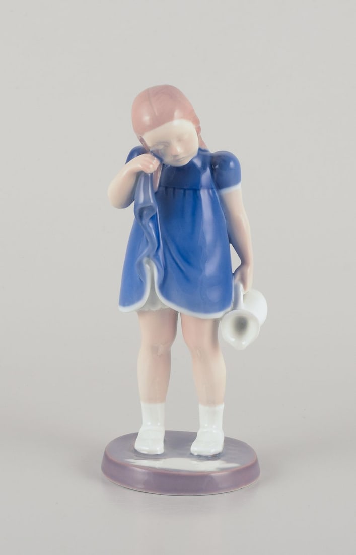 Bing and Grondahl, Denmark. Porcelain figure of a girl with spilled milk.: Title: Bing and Grondahl, Denmark. Porcelain figure of a girl with spilled milk. Description: Bing and Grondahl, Denmark. Porcelain figure of a girl with a jug. "Spilled Milk / Do not cry over spilled