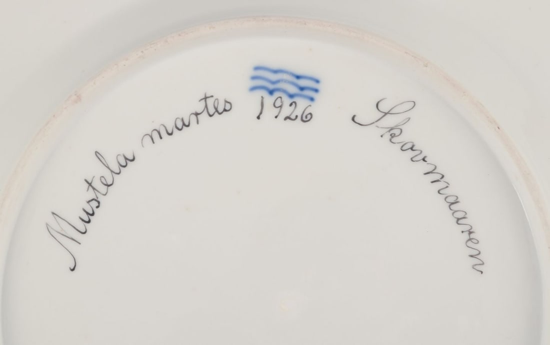 Royal Copenhagen Fauna Danica, dinner plate featuring a motif of a pine marten. Dated 1926 - 7