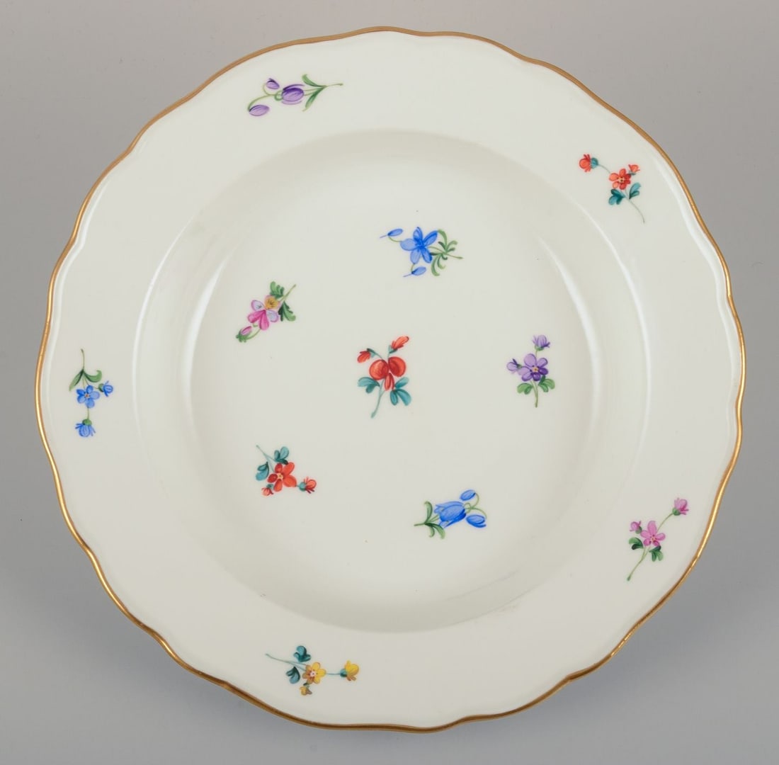 Meissen, Germany. A set of four deep plates in porcelain with polychrome floral motifs and gold rim. - 3
