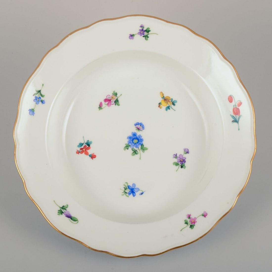 Meissen, Germany. A set of four deep plates in porcelain with polychrome floral motifs and gold rim. - 4