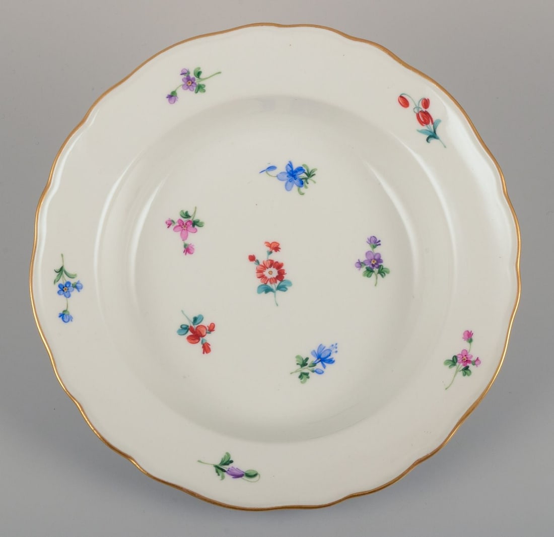 Meissen, Germany. A set of four deep plates in porcelain with polychrome floral motifs and gold rim. - 5