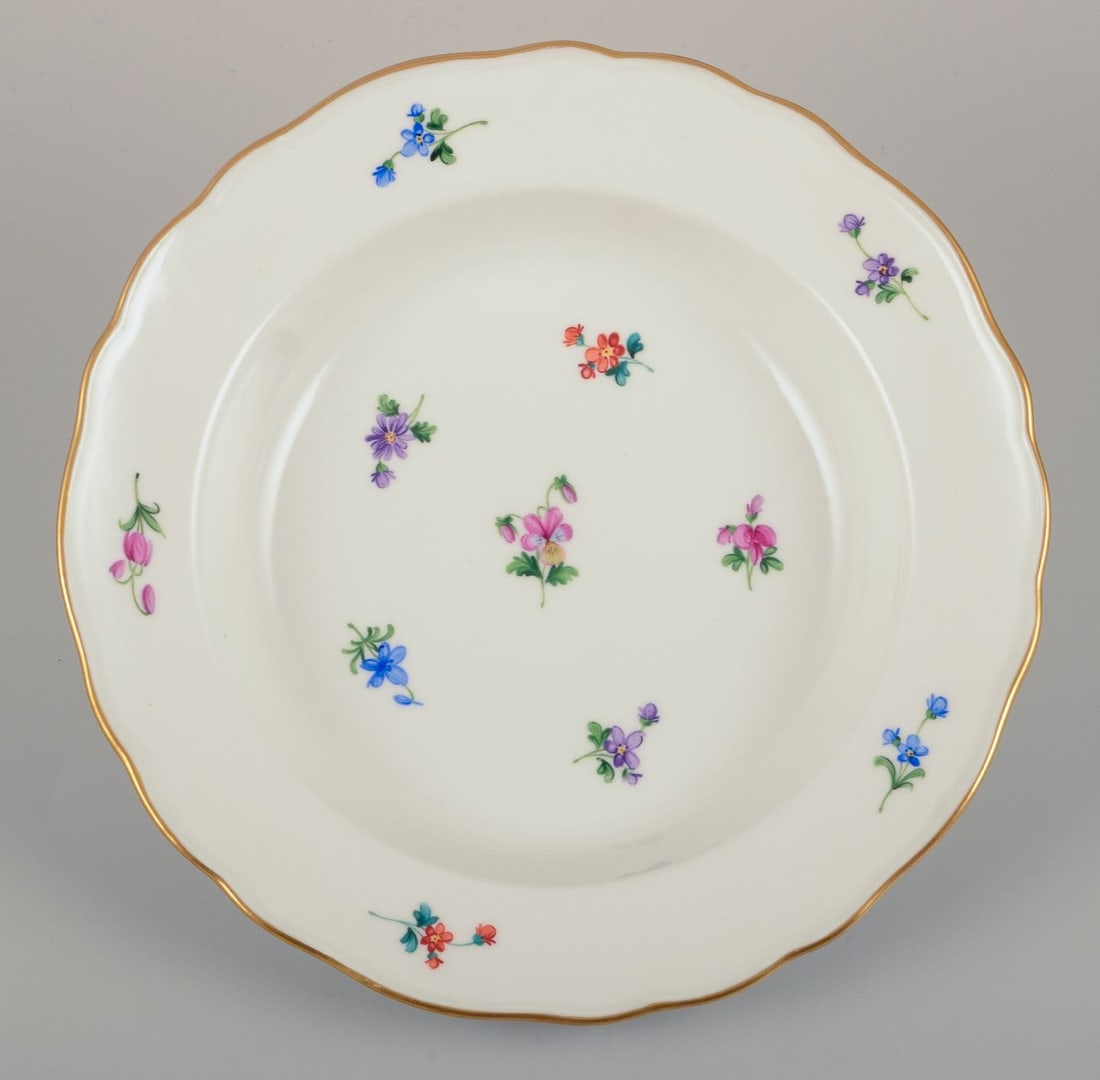 Meissen, Germany. A set of four deep plates in porcelain with polychrome floral motifs and gold rim. - 2