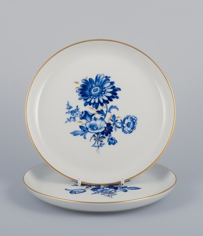 Meissen, Germany. Two plates. Hand-decorated with blue floral motifs, gold rim.: Title: Meissen, Germany. Two plates. Hand-decorated with blue floral motifs, gold rim. Description: Meissen, Germany. Two plates. Hand-decorated with blue floral motifs, gold rim. Mid-20th century. Si