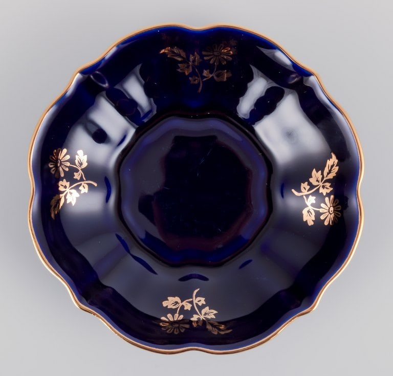 Limoges, France. Two pieces of porcelain consisting of a coffee cup and sugar bowl decorated with - 6