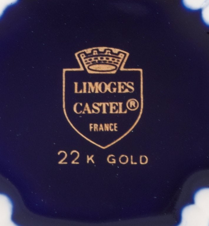 Limoges, France. Two pieces of porcelain consisting of a coffee cup and sugar bowl decorated with - 7