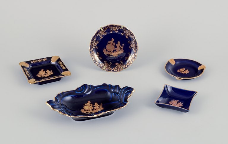 Limoges, France. Five pieces of porcelain including small trays and bowls, decorated with 22-karat (1 of 8)
