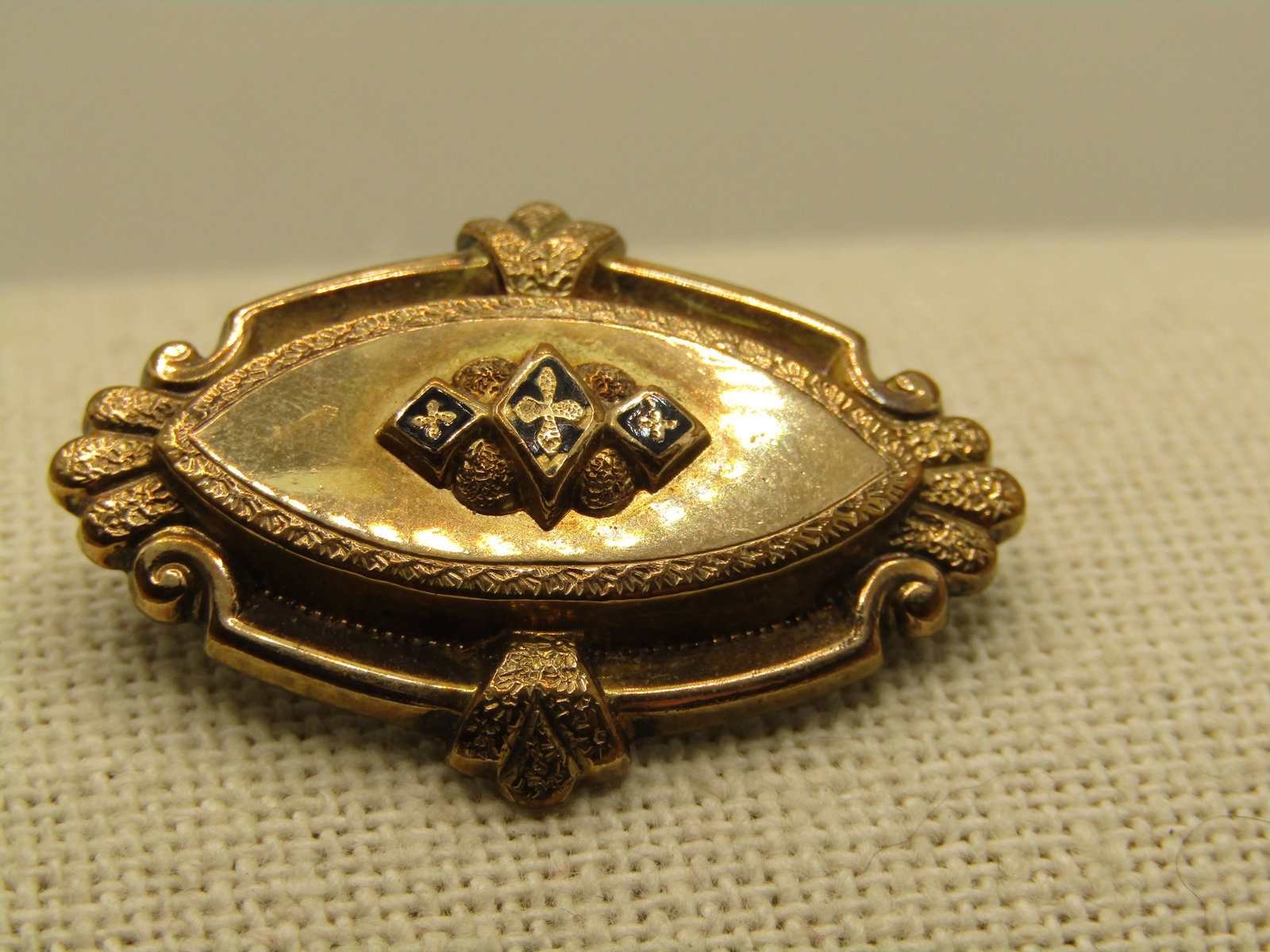 Victorian 10kt G.F. Enameled Brooch, Cross Accents, Tiered: Victorian 10kt G.F. Enameled Brooch/Pendant Cross Accents, Tiered. This is just short of 1.5" wide and 1" tall. It has both the pinback and pendant loop. It tests as 10kt gold filled. It is a teared d