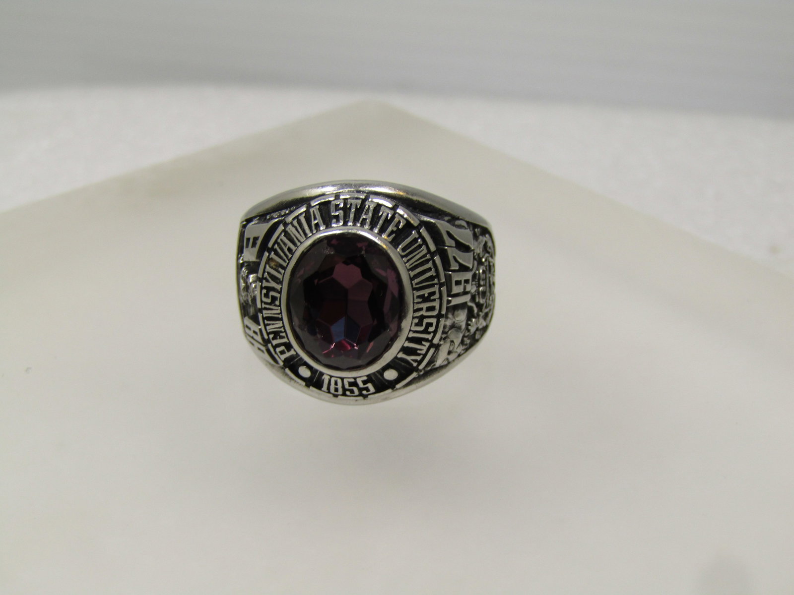 Vintage PSU 1977 Class Ring, Sz. 11.75, Siladium, Penn State Unsiversity, Signed ArtCarved: Vintage PSU 1977 Class Ring, Sz. 11.75, Siladium, Penn State Unsiversity, Signed ArtCarved. This has a purple faceted stone that is testing as Spinel or Topaz on the Presidium. The stone is oval and a